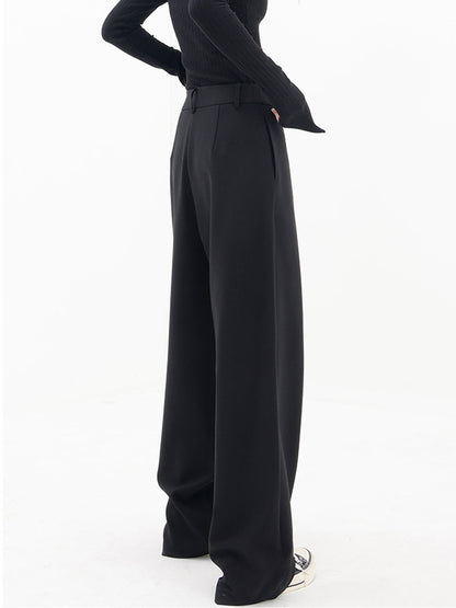 Pantalons larges à jambes asymétriques avec boutons