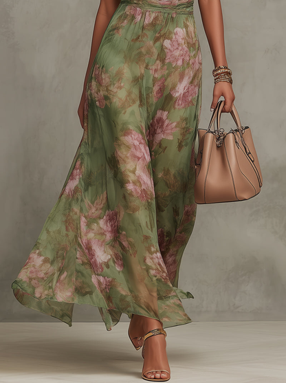 Robe longue en mousseline fleurie verte avec décolleté dos nu