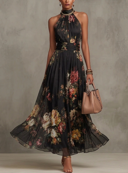 Robe longue en mousseline de soie noire à fleurs avec décolleté dos nu