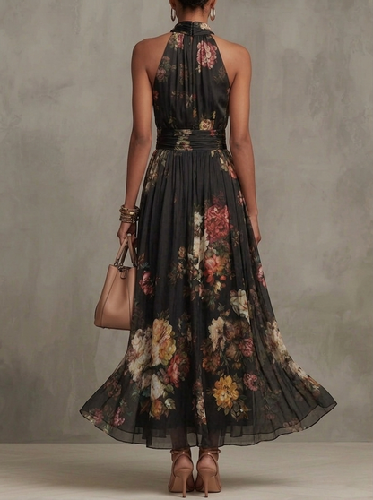 Robe longue en mousseline de soie noire à fleurs avec décolleté dos nu