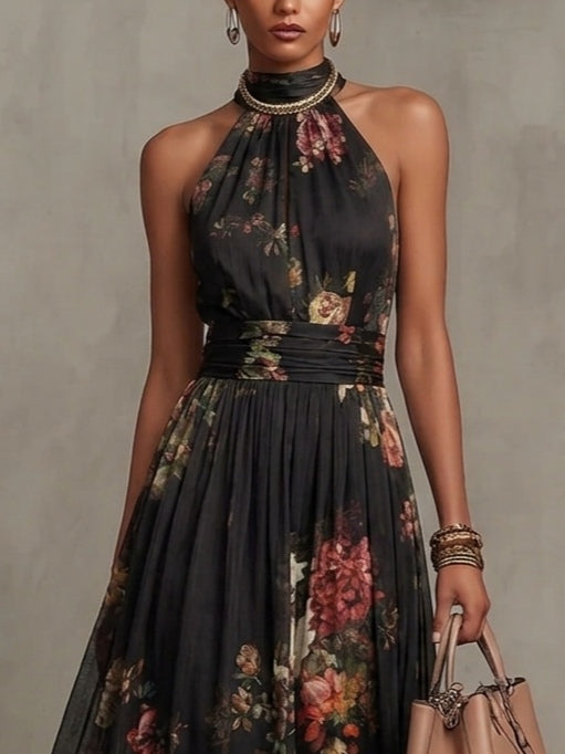 Robe longue en mousseline de soie noire à fleurs avec décolleté dos nu