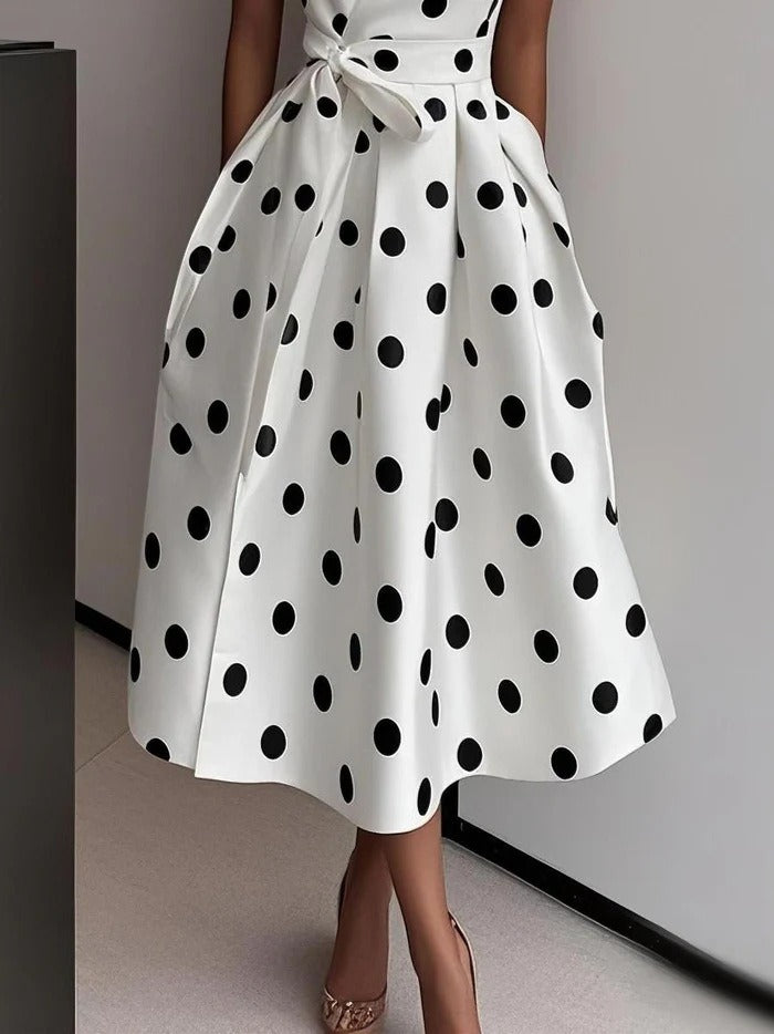 Robe à pois avec nœud élégant