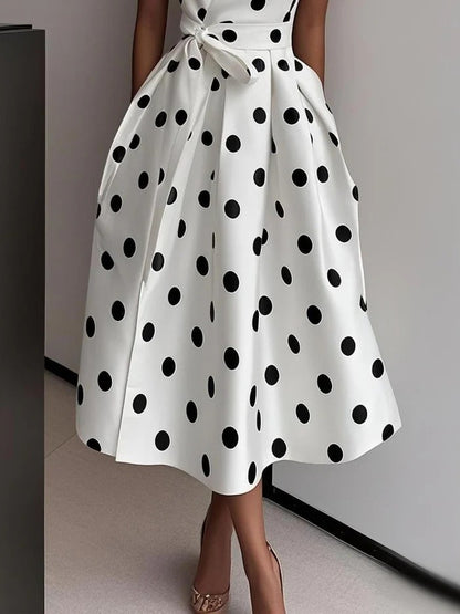 Robe à pois avec nœud élégant