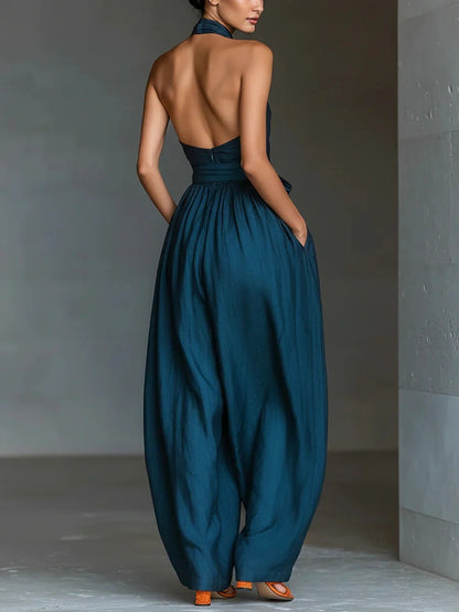 Combinaison femme à col américain croisé, poches, dos nu, taille à nouer et jambes larges